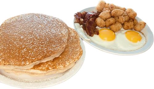 a plate of breakfast food with a sandwich and eggs at Alhonna Resort in Lake Ozark