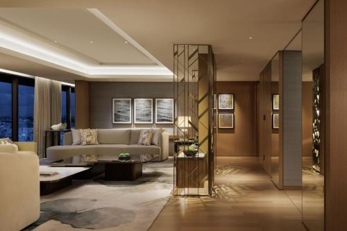a living room with a couch and a table at The Westin Yokohama in Yokohama