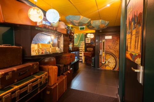 a room with a bunch of suitcases in a store at Hotel The Happy Traveler in Groningen