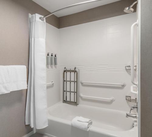 a bathroom with a bath tub and a shower at Residence Inn Phoenix Glendale Sports & Entertainment District in Glendale