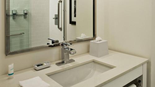 a bathroom with a sink and a mirror at Fairfield Inn & Suites by Marriott Chattanooga in Chattanooga