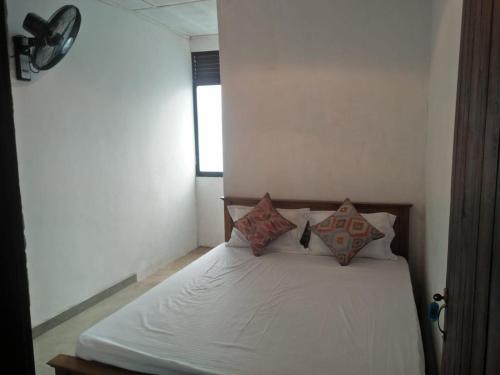 Postel nebo postele na pokoji v ubytování The Jesmine Homestay