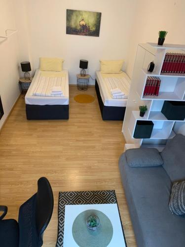 Säng eller sängar i ett rum på City Apartments direkt am Hauptbahnhof