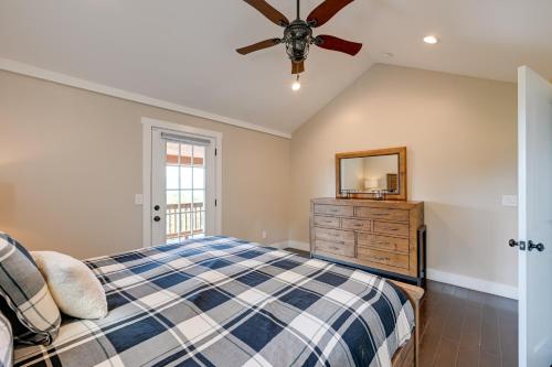 a bedroom with a bed and a ceiling fan at Beautiful Franklin Home with Bunkhouse and Hot Tub! in Franklin
