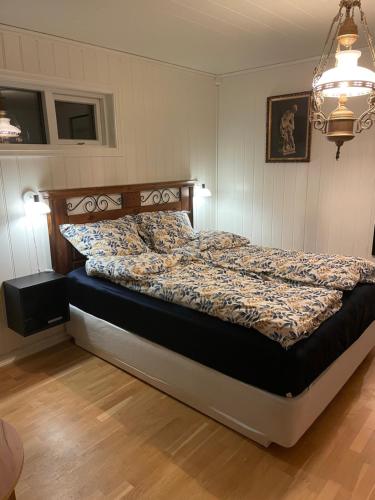 a bedroom with a bed in a room at Josygaard in Austefjorden