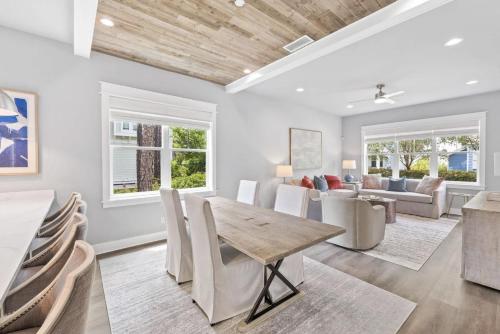 a dining room with a table and chairs at Scissortail at Treetop in Santa Rosa Beach