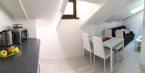 a kitchen and dining room with a table and chairs at Tourist House Bologna - Self check-in in Bologna