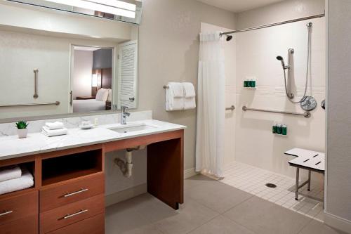 a bathroom with a sink and a shower at Residence Inn Los Angeles LAX/Manhattan Beach in Manhattan Beach