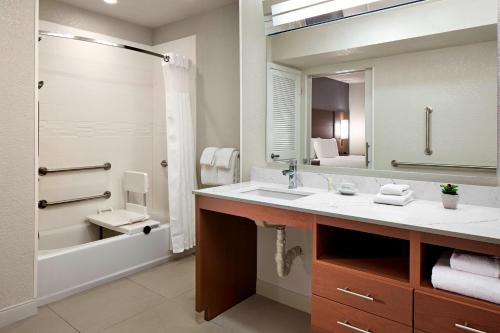a bathroom with a sink and a large mirror at Residence Inn Los Angeles LAX/Manhattan Beach in Manhattan Beach