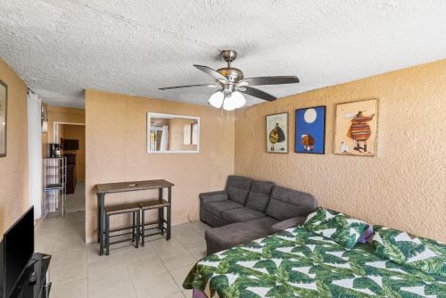 a living room with a couch and a ceiling fan at Caribbean View condo in Christiansted