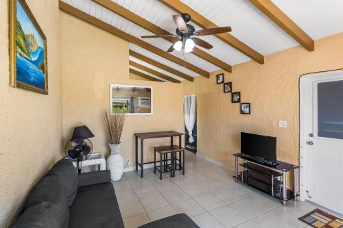a living room with a couch and a ceiling fan at Caribbean View for You condo in Christiansted