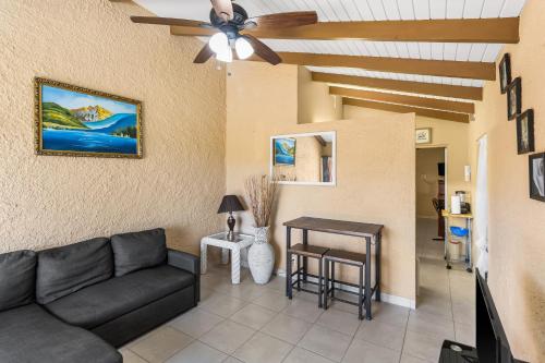 a living room with a couch and a table at Caribbean View for You condo in Christiansted