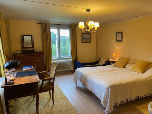 Postel nebo postele na pokoji v ubytování Handlarens villa - Vandrarhem de luxe