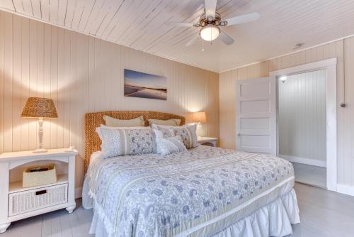 a bedroom with a bed and a ceiling fan at Oceans Away in Seaside