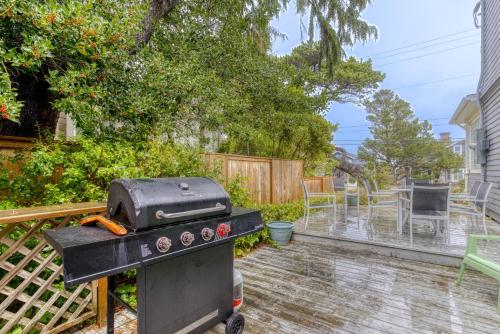 a backyard with a grill and a table at Oceans Away in Seaside