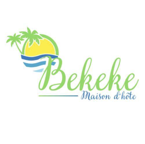 a beach logo with a pineapple and a wave at Bekeke in Capesterre-de-Marie-Galante