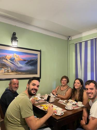a group of people sitting at a table eating at Hotel Bhaktapur Inn in Bhaktapur