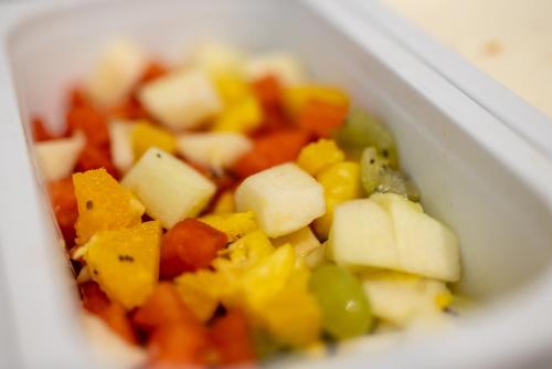 a close up of vegetables in a white container at Hotel Lüttje Burg in Lütjenburg