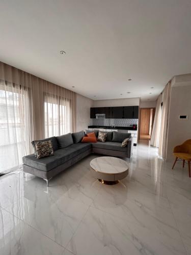 a living room with a couch and a table at Maarif Elite Suites in Casablanca