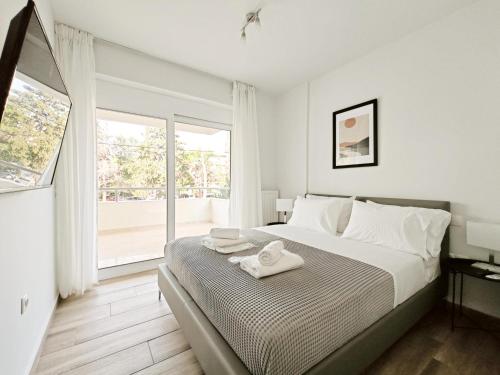 Ένα ή περισσότερα κρεβάτια σε δωμάτιο στο Kapodistriou by Verde Apartments