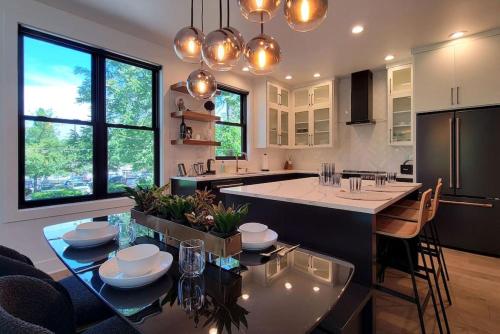 a kitchen with a large island with a dining table at Station House Suite A in Jacksonville