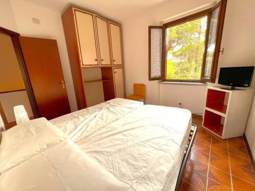A bed or beds in a room at Residence Paguro