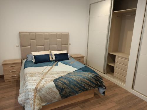a bedroom with a large bed and a closet at Casa pepe in Madrid