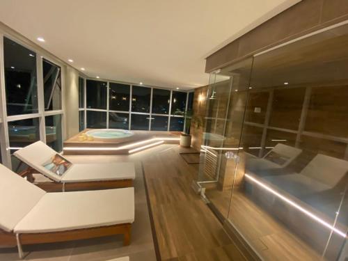 Edifício Promenade II Apt 404-Mandi Hospitalidadeにあるシーティングエリア