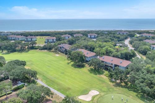 an overhead view of a golf course with a house at Sea-Nic View in Caswell Beach