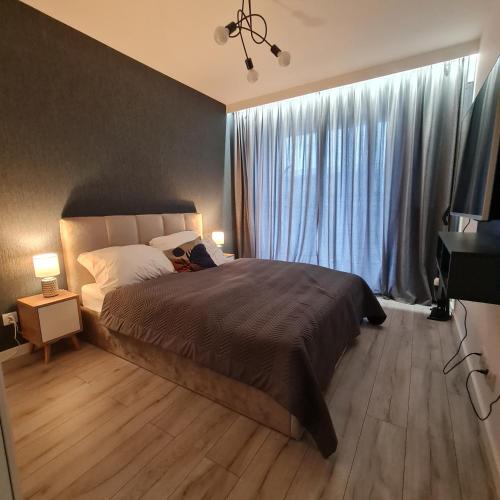Säng eller sängar i ett rum på Green De Lux Apartament Dziwnów