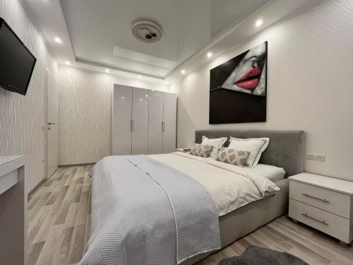Ένα ή περισσότερα κρεβάτια σε δωμάτιο στο Апартаменти в Arena Apart