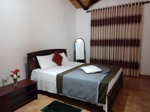 Ліжко або ліжка в номері Pebbles Holiday Bungalow Bandarawela