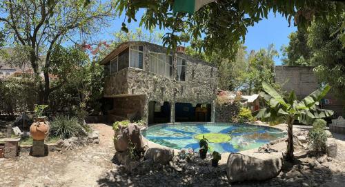 a model of a house with a swimming pool at LA CASA DE LOS MANGOS AJIJIC in San Antonio