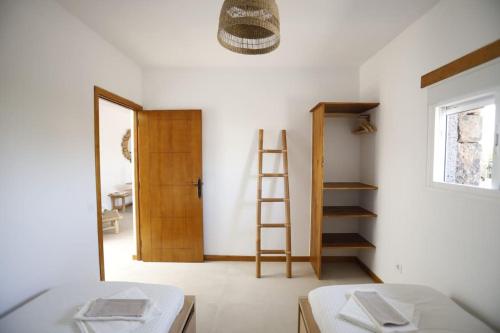 Ένα ή περισσότερα κρεβάτια σε δωμάτιο στο Casa Anahita