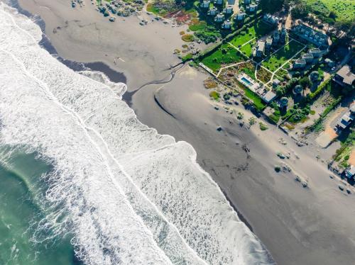an aerial view of the beach and ocean at Lodge del Mar in Pichilemu