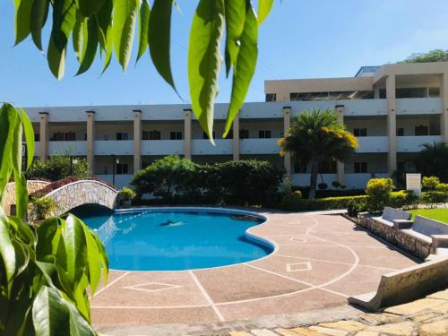 a swimming pool in front of a building at Hotel Santa Engracia in Ciudad Valles