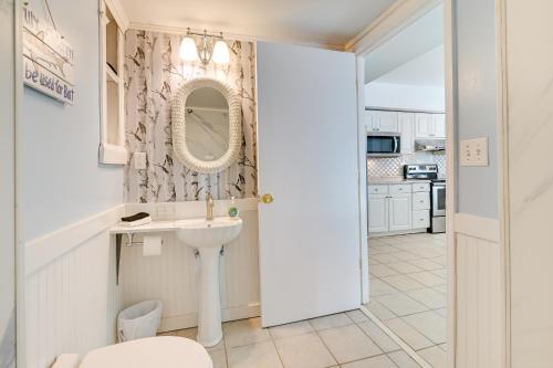 a bathroom with a sink and a mirror at Pawleys Island Retreat - Golf Cart Included! in Pawleys Island