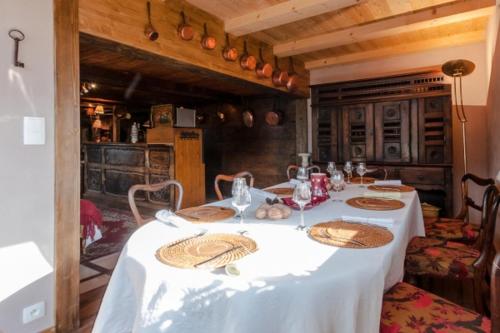 a table in a kitchen with a white table cloth at Chalet La Voraz in Châtel