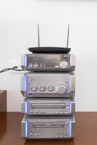 a stack of video game systems sitting on top of each other at Casa CarLina in Treviglio