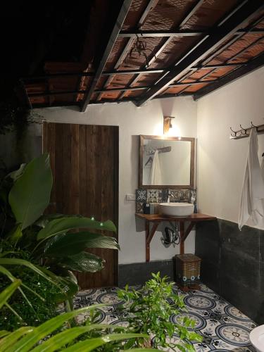 a bathroom with a sink and a mirror at Thom's House in Ninh Binh