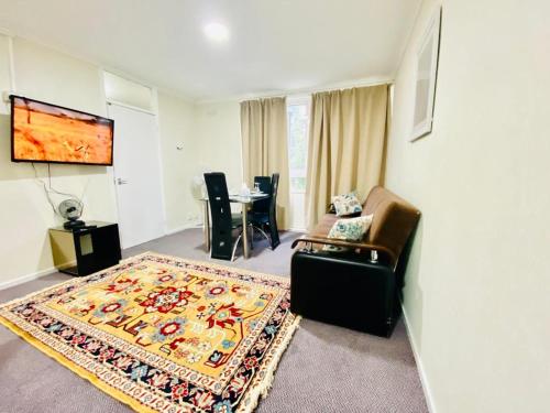 a living room with a couch and a table at Spacious One bedroom apartment Edgeware Road Central London in London