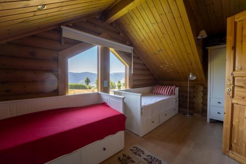 a bedroom with a bed and a large window at The Flysch in Miríki