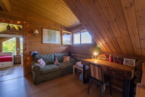 a living room with a couch and a table at The Flysch in Miríki