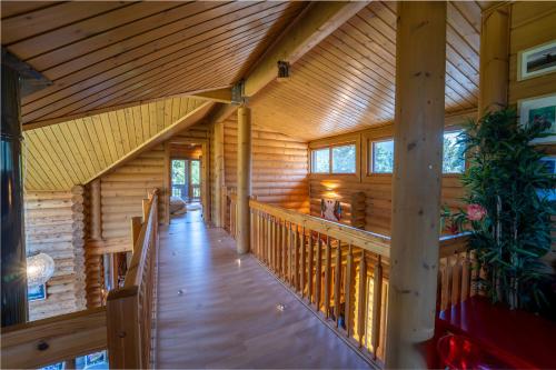 a large wooden hallway in a log cabin at The Flysch in Miríki