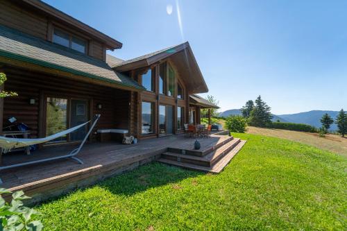 a house with a porch with a hammock on it at The Flysch in Miríki