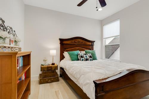 a bedroom with a large bed and a window at EastSide Rooftop Oasis in Austin