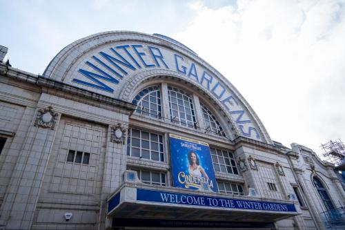 a building with a sign for the winter palace at Holiday Inn Blackpool by IHG in Blackpool