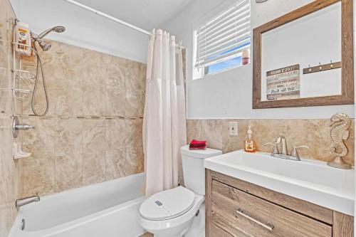 a bathroom with a sink and a toilet and a bath tub at Hollywood Vacation Mins To Beach & Hard Rock #193 in Hollywood