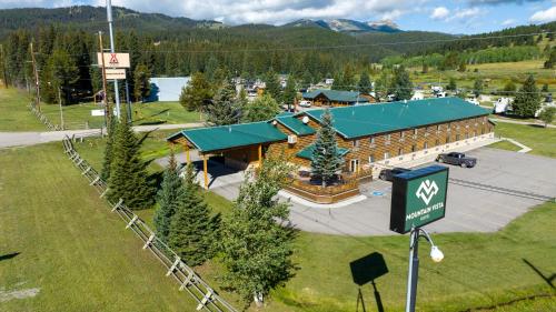 an overhead view of a large building with a green roof at Mountain Vista Hotel in West Yellowstone