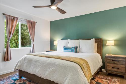 a bedroom with a large bed and a window at Starry Nights - River Wineries Huge Fenced Yard in Forestville